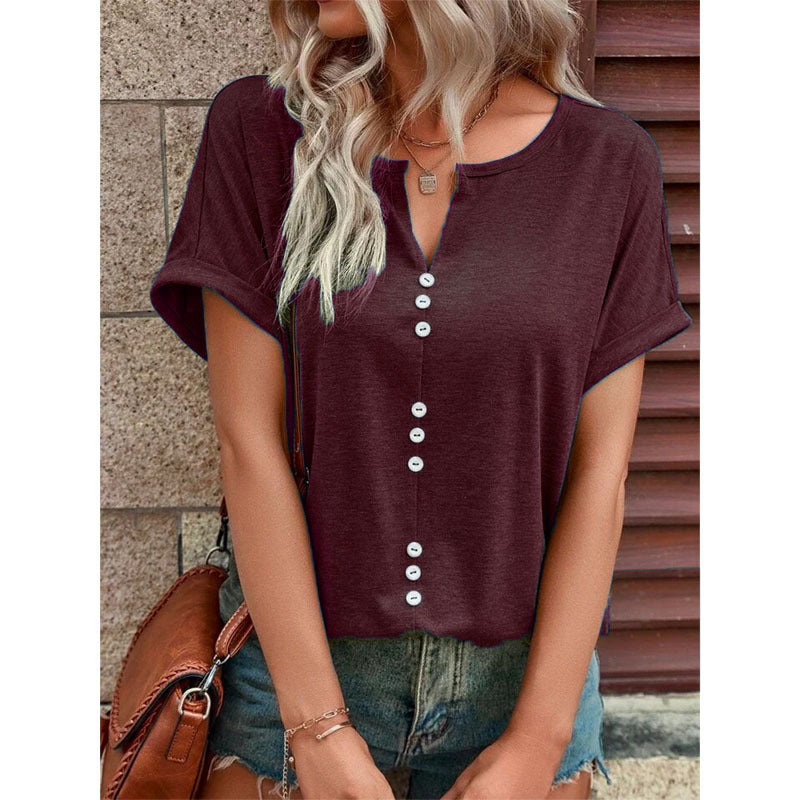 Barbara – V-ringad kortärmad blus med knappdesign