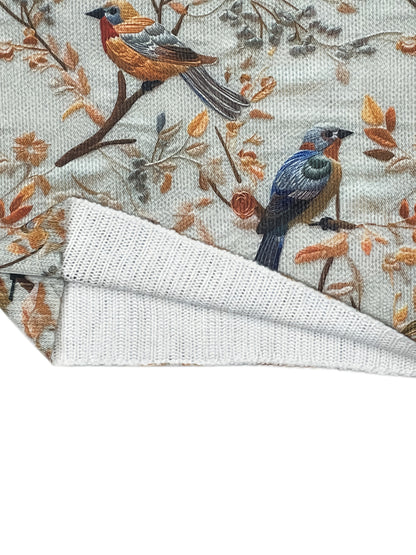 Damstickad tröja med fågelmotiv och hög krage – elegant vardagsmode