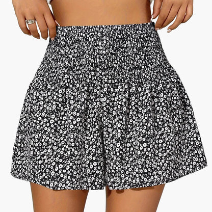 Damshorts med Blommigt Mönster och Smockad Midja – Trendiga Sommarshorts för Fritid och Semester