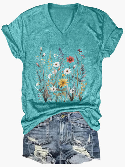 Dam T-shirt med v-ringning och blommönster – avslappnad sommarstil