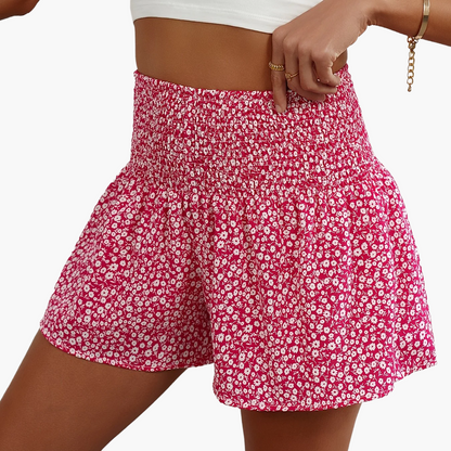 Damshorts med Blommigt Mönster och Smockad Midja – Trendiga Sommarshorts för Fritid och Semester