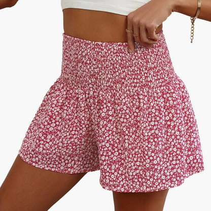 Damshorts med Blommigt Mönster och Smockad Midja – Trendiga Sommarshorts för Fritid och Semester